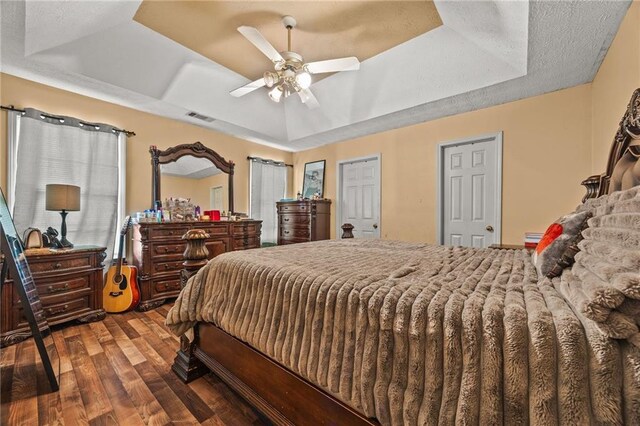 1230 Brook Meadow Ct, Lawrenceville, GA 30045 - bedroom with a raised ceiling, wood finished floors, and a ceiling fan