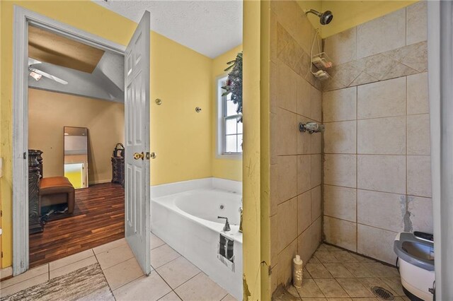 1230 Brook Meadow Ct, Lawrenceville, GA 30045 - bathroom with tile patterned flooring, a garden tub, and a tile shower