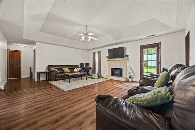 1230 Brook Meadow Ct, Lawrenceville, GA 30045 - living area featuring a raised ceiling, a textured ceiling, baseboards, wood finished floors, and ceiling fan