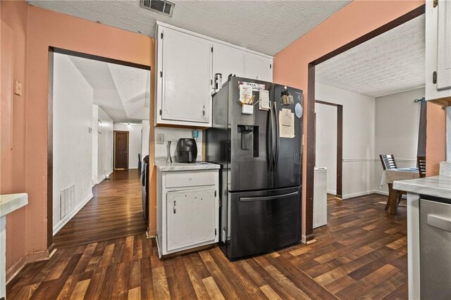 1230 Brook Meadow Ct, Lawrenceville, GA 30045 - kitchen with appliances with stainless steel finishes, white cabinets, a textured ceiling, light countertops, and dark wood-type flooring