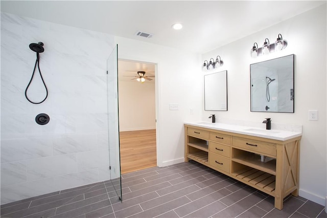 1342 Carter Rd, Decatur, GA 30030 - full bath featuring a walk in shower, double vanity, ceiling fan, and baseboards