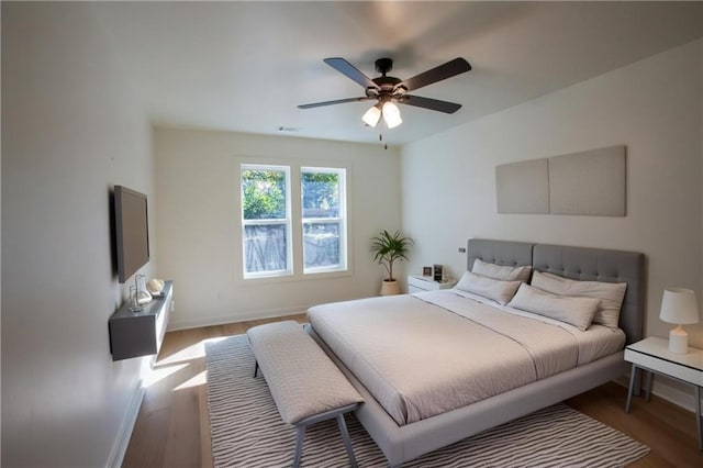 1342 Carter Rd, Decatur, GA 30030 - bedroom with wood finished floors, baseboards, and ceiling fan