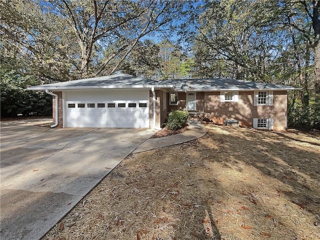 ranch-style home featuring a garage