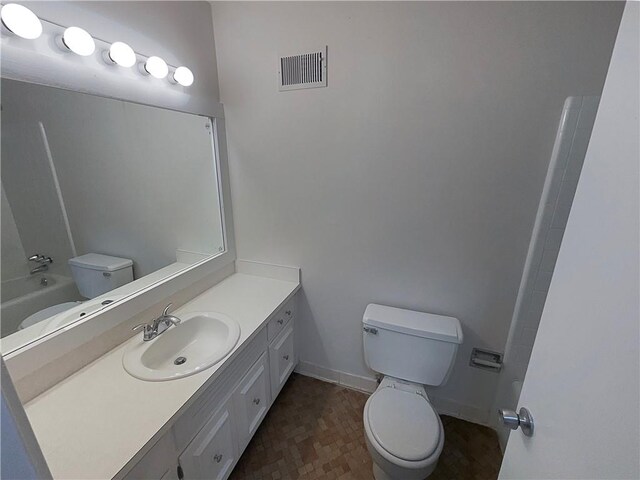 full bathroom featuring vanity, toilet, and tub / shower combination