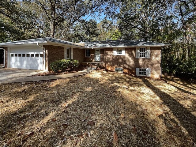 ranch-style house featuring a garage