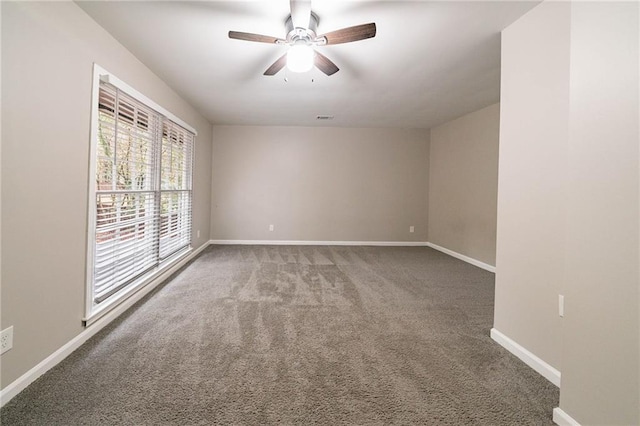 unfurnished room featuring carpet and ceiling fan