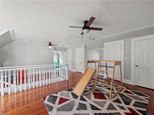 bedroom featuring hardwood / wood-style floors, ceiling fan, and vaulted ceiling