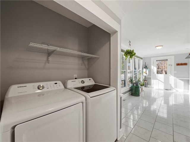 laundry area featuring independent washer and dryer and ornamental molding