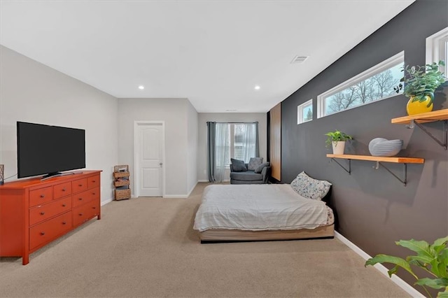 bedroom featuring recessed lighting, visible vents, baseboards, and light carpet