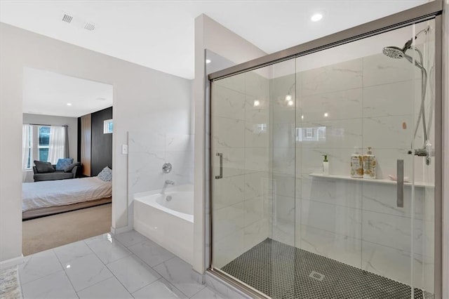 bathroom featuring visible vents, a garden tub, marble finish floor, a stall shower, and ensuite bath