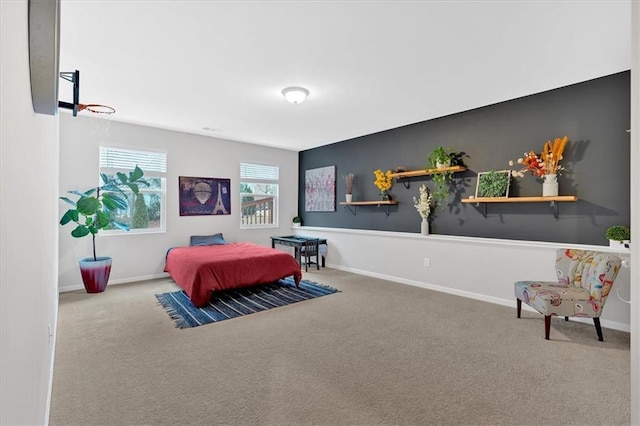 carpeted bedroom featuring baseboards