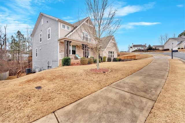 view of front of home with a porch and cooling unit