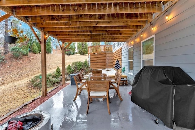 view of patio / terrace featuring outdoor dining area and grilling area