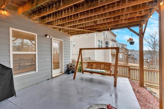 view of patio featuring fence