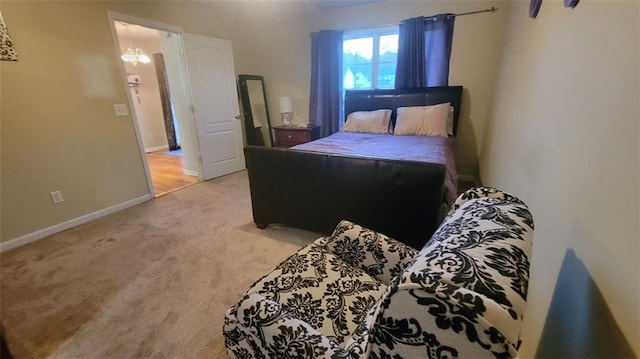 bedroom featuring light colored carpet