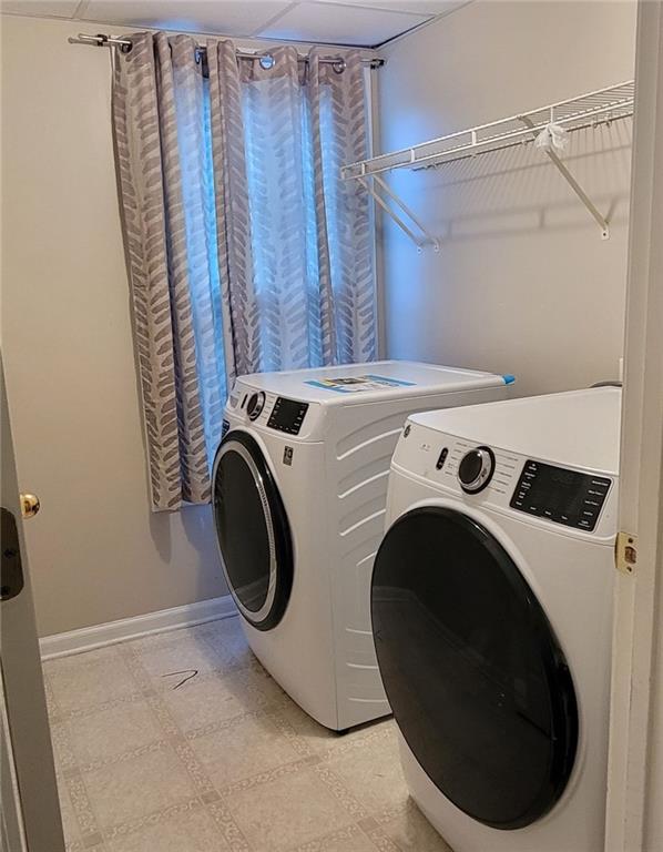 clothes washing area with washer and dryer