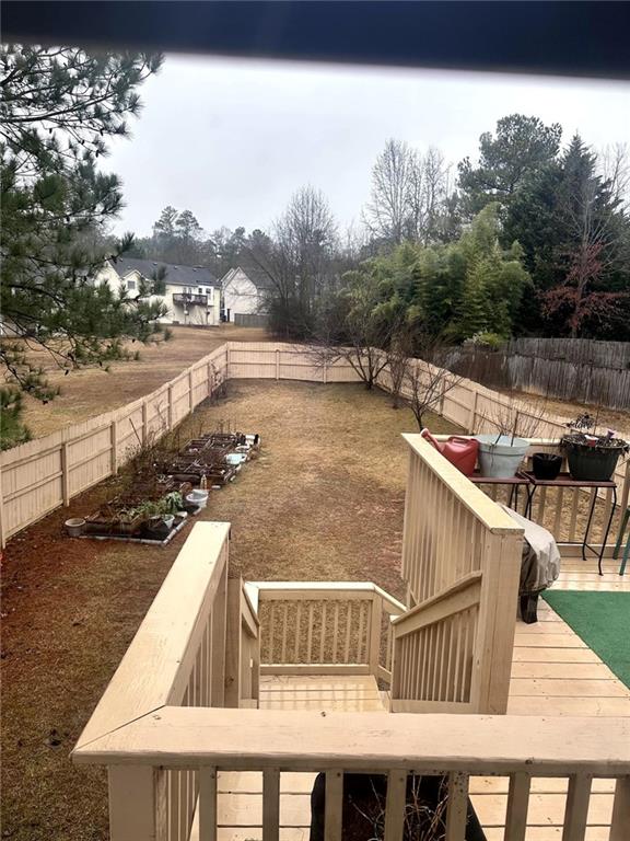 view of yard with a wooden deck