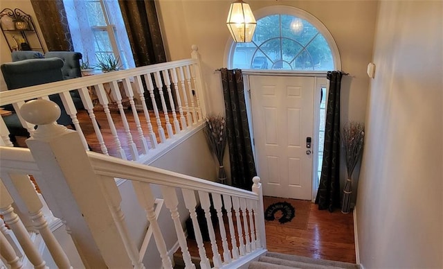 entrance foyer featuring hardwood / wood-style flooring and a chandelier