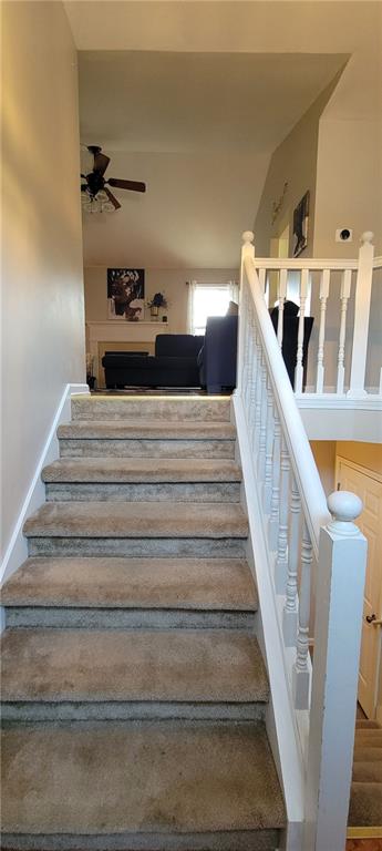 staircase with ceiling fan