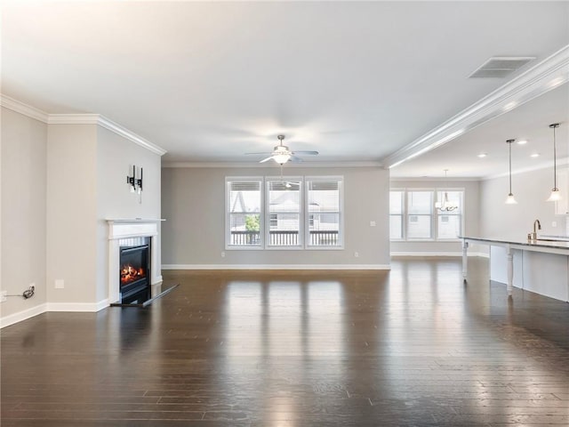 4905 Sterling Close, Buford, GA 30518 - unfurnished living room featuring dark wood finished floors, a glass covered fireplace, baseboards, ornamental molding, and recessed lighting
