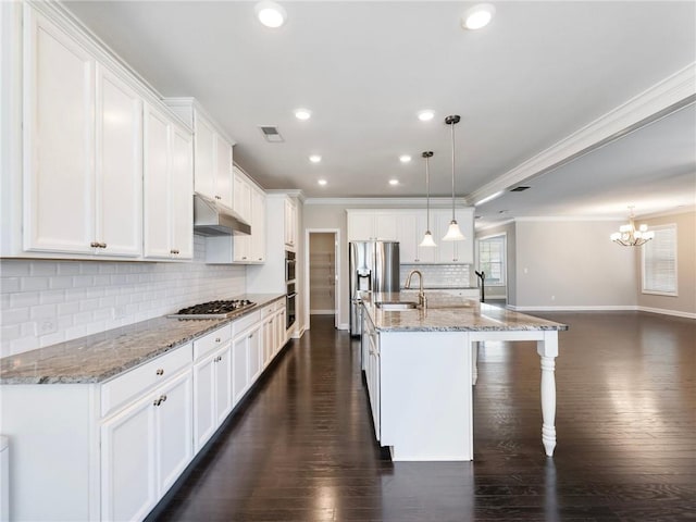 4905 Sterling Close, Buford, GA 30518 - kitchen with under cabinet range hood, crown molding, appliances with stainless steel finishes, baseboards, and recessed lighting