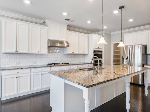 4905 Sterling Close, Buford, GA 30518 - kitchen with under cabinet range hood, appliances with stainless steel finishes, a sink, tasteful backsplash, and crown molding