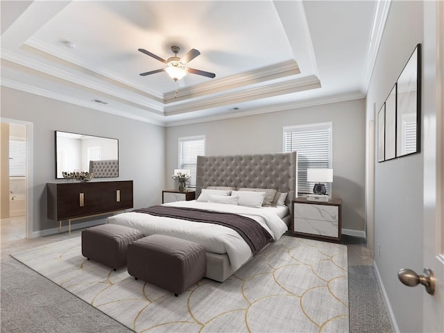 4905 Sterling Close, Buford, GA 30518 - carpeted bedroom featuring a tray ceiling, crown molding, baseboards, ensuite bathroom, and ceiling fan