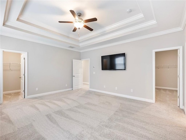 4905 Sterling Close, Buford, GA 30518 - unfurnished bedroom with a walk in closet, a raised ceiling, ornamental molding, and a closet