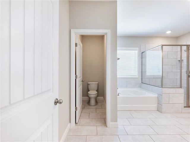 4905 Sterling Close, Buford, GA 30518 - full bathroom with tile patterned floors, a stall shower, a garden tub, toilet, and baseboards