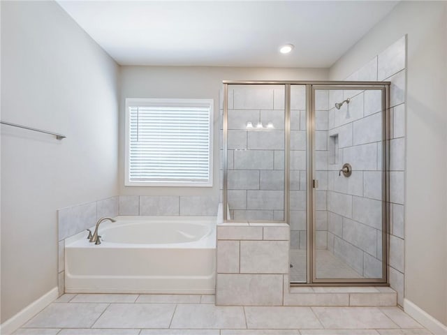 4905 Sterling Close, Buford, GA 30518 - bathroom featuring a bath, tile patterned flooring, a stall shower, and baseboards