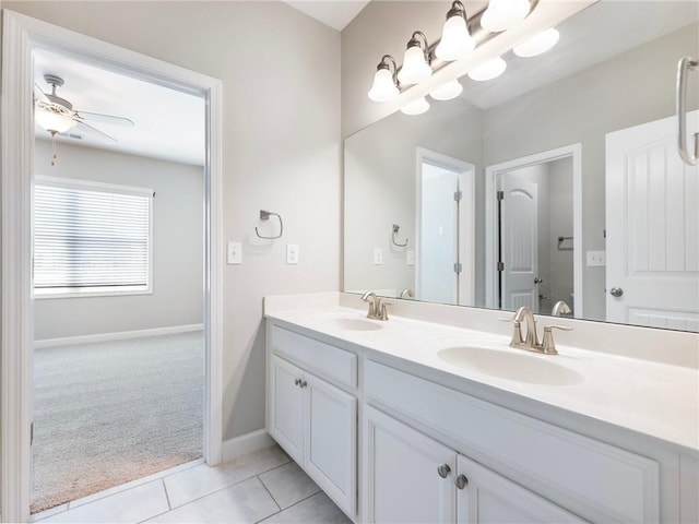 4905 Sterling Close, Buford, GA 30518 - full bathroom with double vanity, tile patterned floors, baseboards, and a chandelier