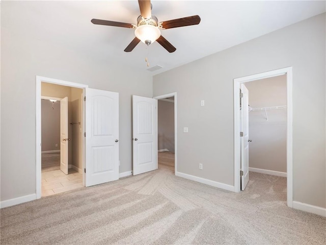 4905 Sterling Close, Buford, GA 30518 - unfurnished bedroom featuring light colored carpet, a spacious closet, ensuite bathroom, and baseboards