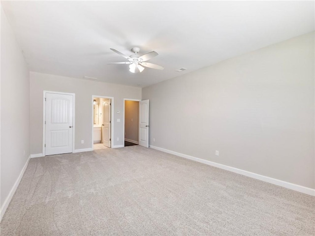 4905 Sterling Close, Buford, GA 30518 - unfurnished bedroom featuring baseboards, light colored carpet, ensuite bathroom, and ceiling fan