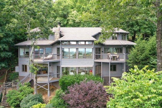 73 Falcon Heights Ln, Big Canoe, GA 30143 - back of house with a balcony, a chimney, and a sunroom
