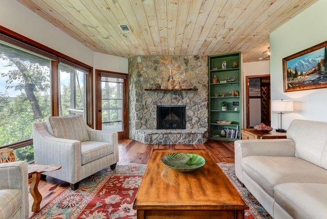 73 Falcon Heights Ln, Big Canoe, GA 30143 - living room with plenty of natural light, wood ceiling, wood finished floors, and a fireplace