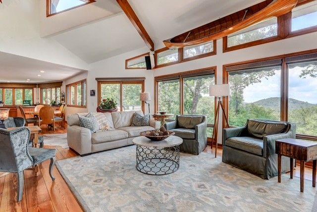 73 Falcon Heights Ln, Big Canoe, GA 30143 - living room featuring high vaulted ceiling, healthy amount of natural light, light wood-style floors, and beam ceiling
