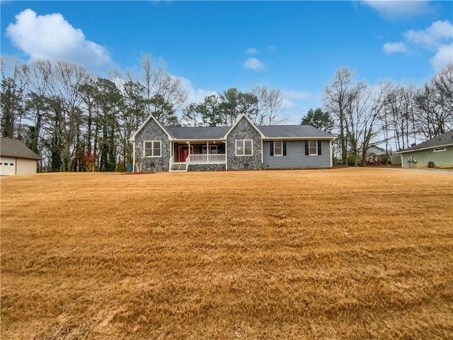 ranch-style home with a front lawn, covered porch, stone siding, and crawl space