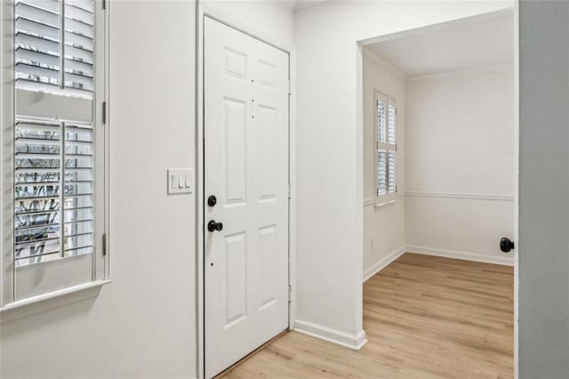 foyer entrance with light hardwood / wood-style floors