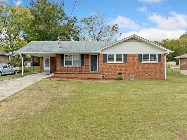 single story home featuring a front lawn and a carport