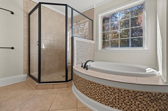 bathroom featuring tile patterned floors, crown molding, and independent shower and bath