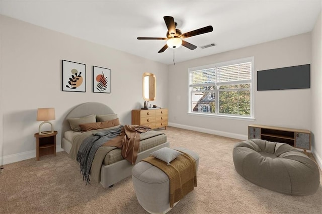 bedroom featuring ceiling fan and carpet