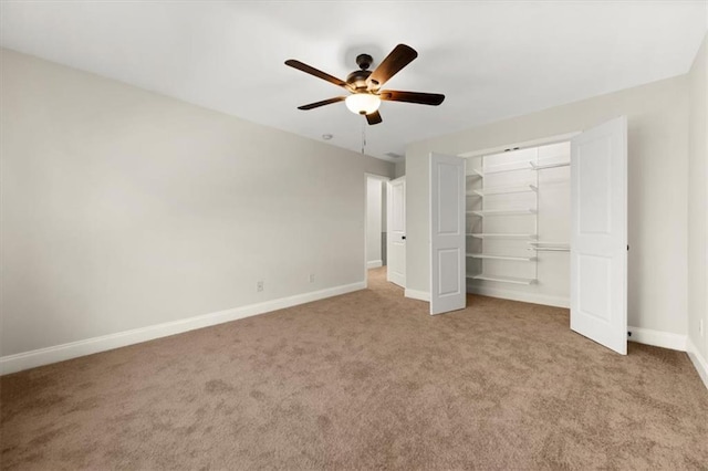 unfurnished bedroom with light carpet, a closet, and ceiling fan