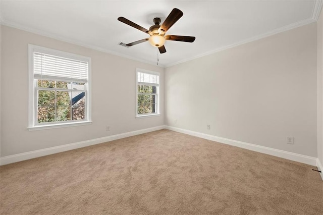 unfurnished room with ceiling fan, light colored carpet, and ornamental molding