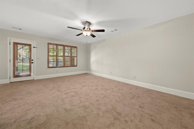 unfurnished room featuring carpet and ceiling fan