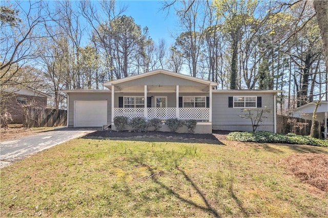 ranch-style house featuring an attached garage, covered porch, and concrete driveway