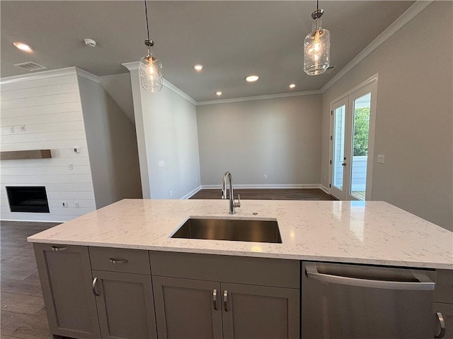 kitchen with dishwasher, gray cabinets, light stone counters, and sink