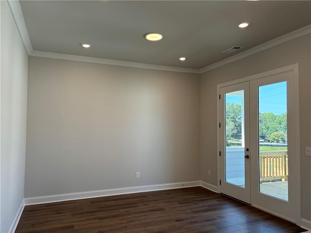 entryway with french doors, ornamental molding, and dark wood-type flooring