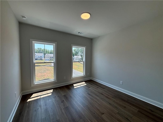 empty room featuring dark hardwood / wood-style floors