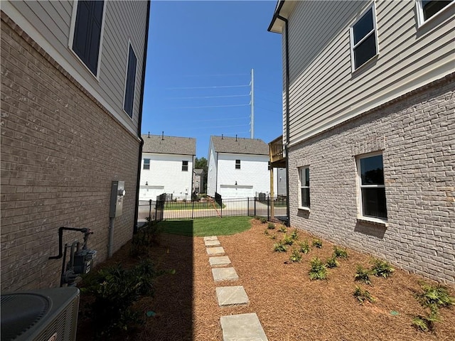 view of yard with central air condition unit