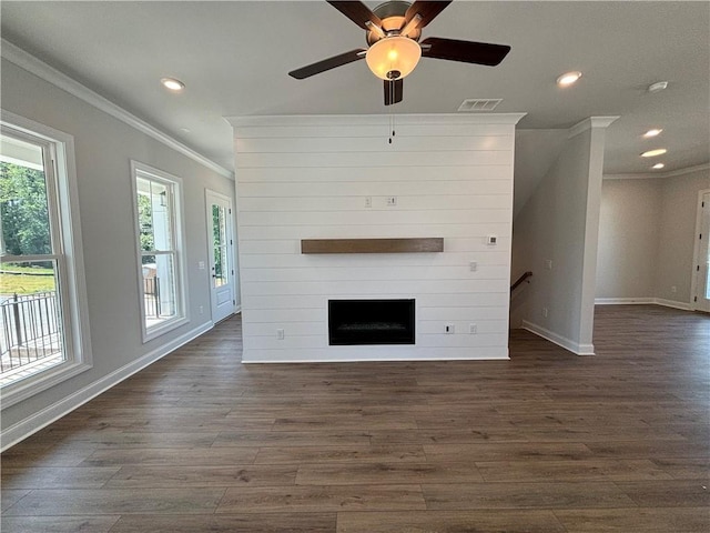 unfurnished living room featuring crown molding, a fireplace, ceiling fan, and dark hardwood / wood-style floors